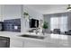 Bright kitchen with stainless steel sink, quartz countertops, and open view to living area at 6738 Rothchild Dr, Charlotte, NC 28270