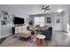 Inviting living room with a large TV, stylish furniture, and an open layout perfect for entertaining at 6738 Rothchild Dr, Charlotte, NC 28270