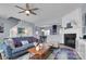 Comfortable living room with cozy seating, fireplace, open layout, and lots of natural light at 6738 Rothchild Dr, Charlotte, NC 28270