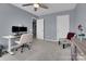 This home office features a window, carpet flooring, a ceiling fan, and gray walls at 6738 Rothchild Dr, Charlotte, NC 28270