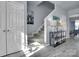Hallway view showcasing stairs, storage closet, and an accent table with decor at 6738 Rothchild Dr, Charlotte, NC 28270