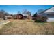 View of home with a spacious backyard featuring mature trees and outbuildings at 850 Dunns Mountain Church Rd # 1, Salisbury, NC 28146