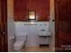 Bathroom with wood cabinets, white tile and older toilet and sink at 850 Dunns Mountain Church Rd # 1, Salisbury, NC 28146