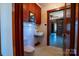 Bathroom with white tile, older toilet and sink and access to other rooms at 850 Dunns Mountain Church Rd # 1, Salisbury, NC 28146