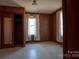 Bedroom with wood paneling, and a window with side closets on either side at 850 Dunns Mountain Church Rd # 1, Salisbury, NC 28146