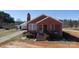 Charming brick home featuring a cozy front porch and well-maintained landscaping at 850 Dunns Mountain Church Rd # 1, Salisbury, NC 28146