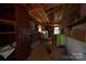 Rustic interior space with exposed wooden beams and shelves, offering potential for renovation at 850 Dunns Mountain Church Rd # 1, Salisbury, NC 28146
