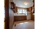 Functional Kitchen with wood cabinets, a white refrigerator, and shelving above the countertops at 850 Dunns Mountain Church Rd # 1, Salisbury, NC 28146