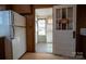 Functional Kitchen with a side door to the patio and wood cabinets and shelving above the countertops at 850 Dunns Mountain Church Rd # 1, Salisbury, NC 28146