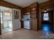 Functional Kitchen with wood cabinets, a white stove, and shelving above the countertops at 850 Dunns Mountain Church Rd # 1, Salisbury, NC 28146