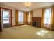Living room with a charming brick fireplace, natural light at 850 Dunns Mountain Church Rd # 1, Salisbury, NC 28146