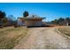 Exterior view of white outbuilding featuring drive-through doors at 850 Dunns Mountain Church Rd # 1, Salisbury, NC 28146