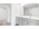Bathroom with dual sinks, white cabinets, and a large mirror at 878 Two Brothers Ln, York, SC 29745
