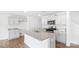 Bright kitchen with white cabinetry, granite countertops, and stainless steel appliances at 878 Two Brothers Ln, York, SC 29745