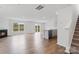 Open-concept living space with fireplace, hardwood floors, and views of the outdoors at 878 Two Brothers Ln, York, SC 29745