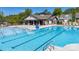 Community pool with lounge chairs and a nearby clubhouse at 878 Two Brothers Ln, York, SC 29745