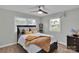 Cozy bedroom with natural light, ceiling fan, and wood floors offers a comfortable retreat at 905 Blalock Dr, Kings Mountain, NC 28086