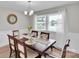 An inviting dining room features a bright window with natural light and modern chandelier at 905 Blalock Dr, Kings Mountain, NC 28086