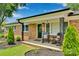 Inviting front porch with rocking chairs, complementing the classic brick exterior and landscaped yard at 905 Blalock Dr, Kings Mountain, NC 28086