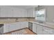 Bright kitchen with white cabinets, lots of lighting and ample counter space for cooking at 905 Blalock Dr, Kings Mountain, NC 28086