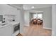 This well-lit home features a laundry area with modern appliances next to an elegant dining room with wood floors at 905 Blalock Dr, Kings Mountain, NC 28086