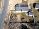 Aerial view of a fenced backyard, house, and outdoor gazebo area, enhancing the property's appeal at 9100 Clancy Pl, Charlotte, NC 28227