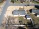 Aerial view of a fenced backyard, with house and outbuildings, offering outdoor living and privacy at 9100 Clancy Pl, Charlotte, NC 28227