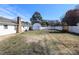 Fenced backyard featuring a small shed, an additional covered outdoor seating area and well-maintained lawn at 9100 Clancy Pl, Charlotte, NC 28227