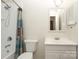 This bathroom features a shower, a vanity with a sink, and a mirror at 9100 Clancy Pl, Charlotte, NC 28227
