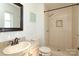 Tiled bathroom with sink, toilet, and walk-in shower at 9100 Clancy Pl, Charlotte, NC 28227