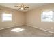 Comfortable bedroom with natural light, neutral paint, and ceiling fan at 9100 Clancy Pl, Charlotte, NC 28227