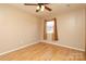 Bedroom with hardwood floors, ceiling fan, and window at 9100 Clancy Pl, Charlotte, NC 28227