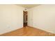 Empty bedroom featuring hardwood floors at 9100 Clancy Pl, Charlotte, NC 28227