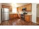 Eat in kitchen featuring stainless steel appliances, cabinets and countertops at 9100 Clancy Pl, Charlotte, NC 28227