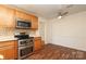 Eat in kitchen featuring stainless steel appliances, cabinets and countertops at 9100 Clancy Pl, Charlotte, NC 28227