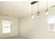Bright living room with decorative pendant lights and sun-filled windows at 9100 Clancy Pl, Charlotte, NC 28227