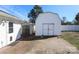 An outdoor shed with double doors and a brick-paved path leading up to it at 9100 Clancy Pl, Charlotte, NC 28227