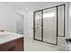 Contemporary bathroom features a glass-enclosed shower and dark wood vanity with white countertop at 9512 Coast Laurel Nw Ave # 42, Concord, NC 28027