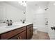 Modern bathroom featuring double sinks with dark wood cabinets, and a shower-tub combo at 9512 Coast Laurel Nw Ave # 42, Concord, NC 28027