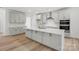Spacious modern kitchen features an island, stainless steel appliances, and light gray cabinetry at 9512 Coast Laurel Nw Ave # 42, Concord, NC 28027