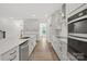 Open-concept kitchen boasts a large island, stainless steel appliances, and natural light at 9512 Coast Laurel Nw Ave # 42, Concord, NC 28027