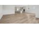 Open floor plan with modern kitchen and spacious living area with wood floors throughout at 9512 Coast Laurel Nw Ave # 42, Concord, NC 28027