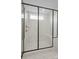 Luxurious walk-in shower with a rainfall showerhead, bench, and large window at 9512 Coast Laurel Nw Ave # 42, Concord, NC 28027
