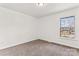 Clean bedroom with neutral carpet and one window offering natural light at 10007 Mountain Apple Dr, Mint Hill, NC 28227