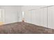 Neutral carpeted bedroom featuring a large closet for ample storage at 10007 Mountain Apple Dr, Mint Hill, NC 28227