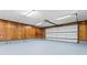 Spacious two car garage featuring painted floors and wood paneling at 10007 Mountain Apple Dr, Mint Hill, NC 28227
