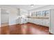 Bright kitchen featuring white cabinets, granite countertops, modern appliances, and a large window at 10007 Mountain Apple Dr, Mint Hill, NC 28227