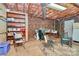 Unfinished basement offers potential for customized space, with exposed ceiling and brick wall at 1069 W Rebound Rd, Van Wyck, SC 29720