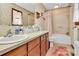 Functional bathroom with a vanity, sink, and a shower-tub combination at 1069 W Rebound Rd, Van Wyck, SC 29720