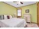 Bedroom with green walls, a patterned bedspread, and a chest of drawers at 1069 W Rebound Rd, Van Wyck, SC 29720